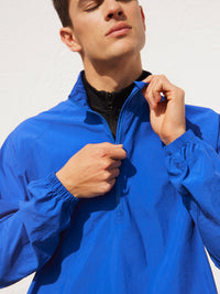 a person wearing a blue jacket
