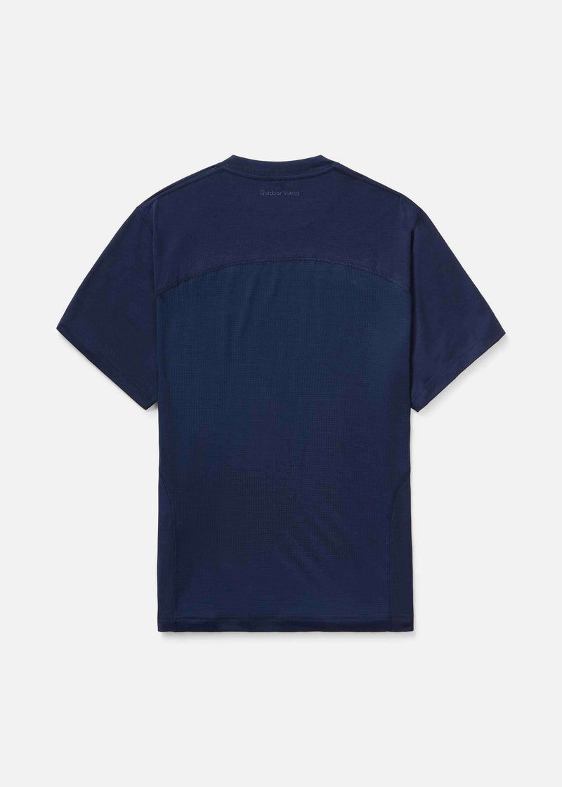 ThinkFast Vent Shortsleeve navy blue back view featuring breathable mesh panel for comfort and performance.