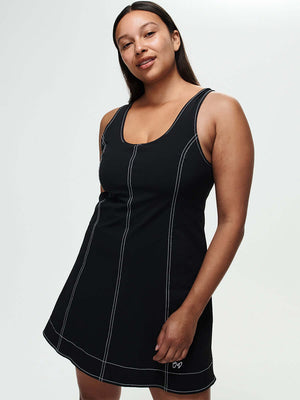 Model showcasing the Energy Dress, featuring A-line silhouette and contrast topstitching in breathable LightSpeed fabric.