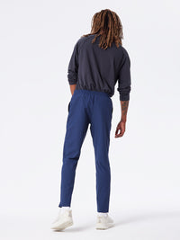 a person wearing a pair of navy pants