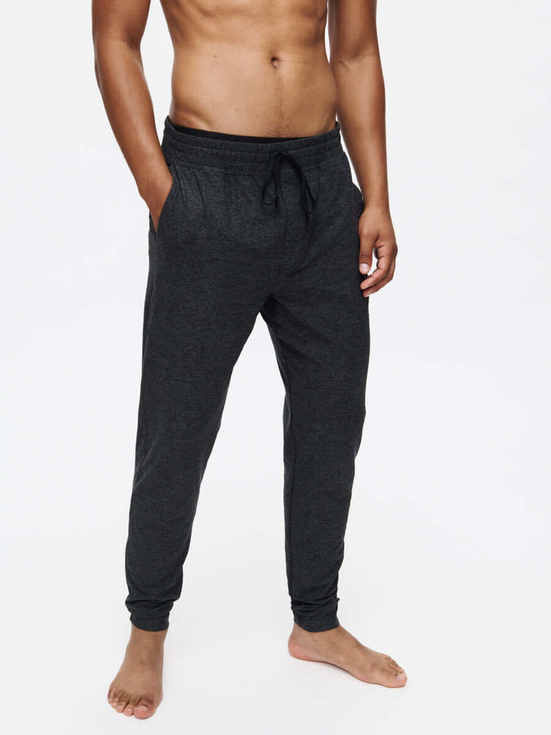 Model wearing CloudKnit Slim Sweatpant, showcasing lightweight fabric and drawstring waistband.