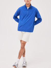a person wearing a blue jacket