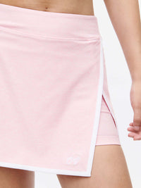 Court Skort 2.5" in pink with white trim and inner leg silicone gripper for a secure fit.