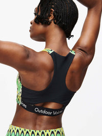 Doing Things Bra with mesh backing and Outdoor Voices logo, perfect for high-performance activities.