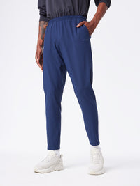 a person wearing a pair of navy pants