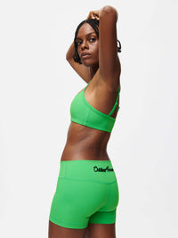Gemini 3" Short in vibrant green, showcasing the silicone gripper and Outdoor Voices logo on back waistband.