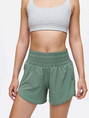 LightSpeed 3" Short in green, high-waisted running shorts featuring breathable fabric and pockets.
