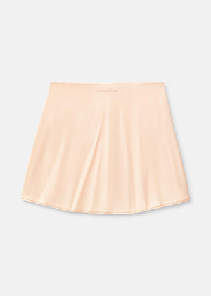 a person wearing a light pink skort
