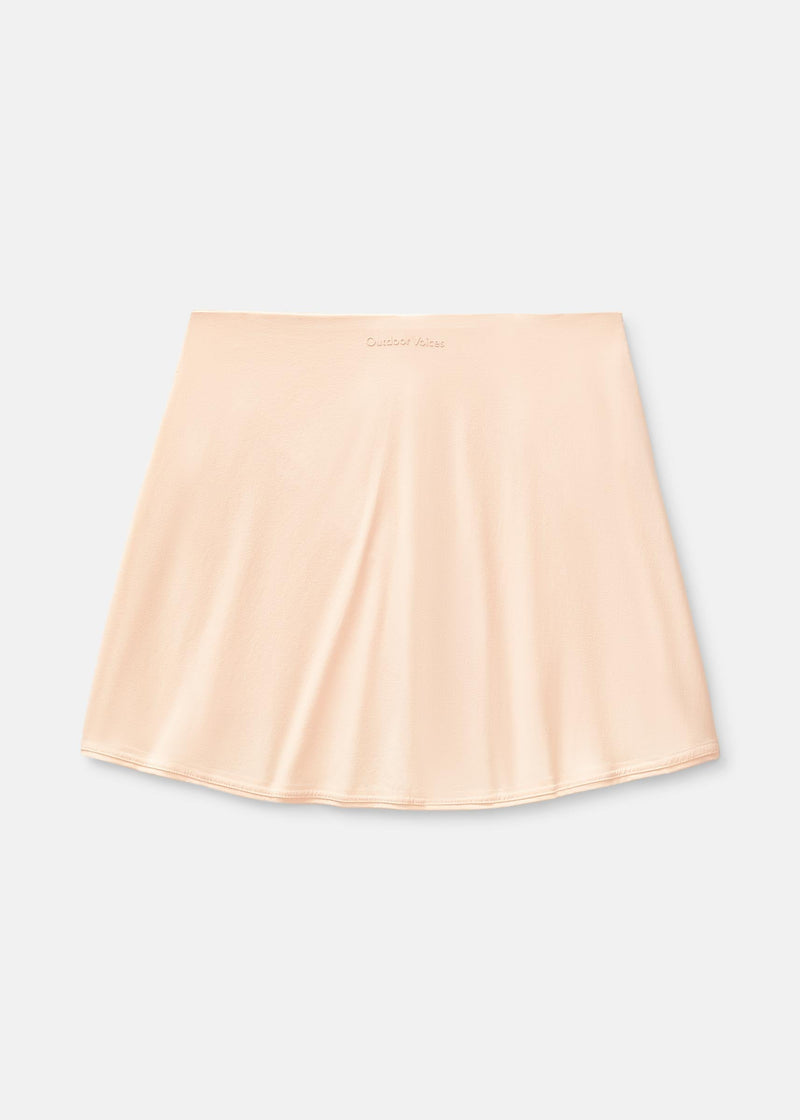 a person wearing a light pink skort