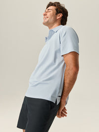 a person wearing a light blue shirt