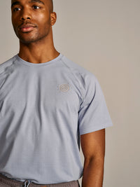 a person wearing a light purple shirt
