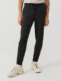 a person wearing black sweatpants