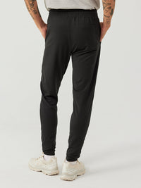 a person wearing black sweatpants