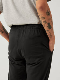 a person wearing black sweatpants