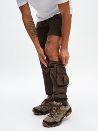 Men's RecTrek Zip-Off Pant in Soil – close-up unzipping the leg