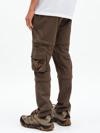 Men's RecTrek Zip-Off Pant in Soil – side close-up of cargo pockets and zip-off seam