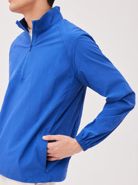 a person wearing a blue jacket