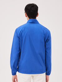 a person wearing a blue jacket