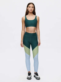Model wearing Springs 7/8 Legging with 3-tone paneling in durable Textured Compression fabric.