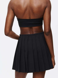 Back view of the Stardust Skirt showcasing pleats and lightweight design.