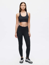 Model wearing TechSweat Core 7/8 Legging with matching sports bra for high intensity workouts.