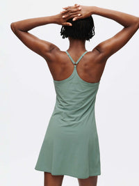 Back view of The Exercise Dress in Sage Green with adjustable straps, ideal for active lifestyles.