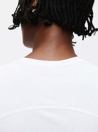 Back view showing the collar of the ThinkFast Jersey Baby Tee and its soft fabric.