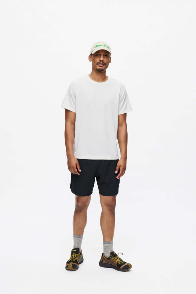 Model wearing ThinkFast Mesh Shortsleeve t-shirt with matching shorts for active adventure.