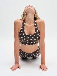 Doing Things Bra in Dark Bay Polka Dot – stretching in upward dog pose