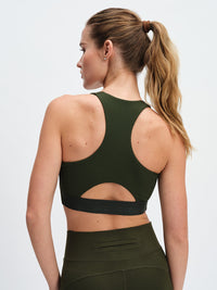 Doing Things Bra in Forest – back close-up of racerback cutout and logo band