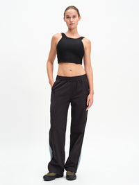 Venus Crop Top in Black – front full-length view styled with track pants