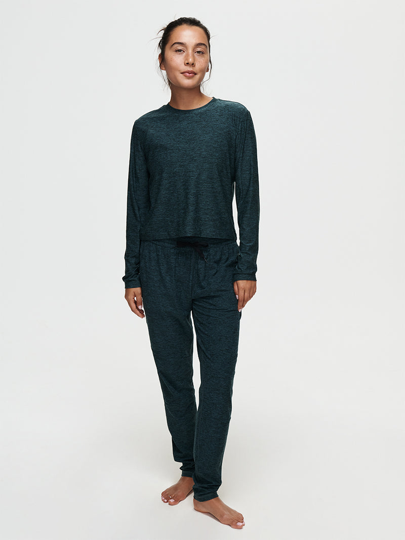 Woman wearing CloudKnit Sweatpant and matching top, showcasing a relaxed and stylish loungewear look.
