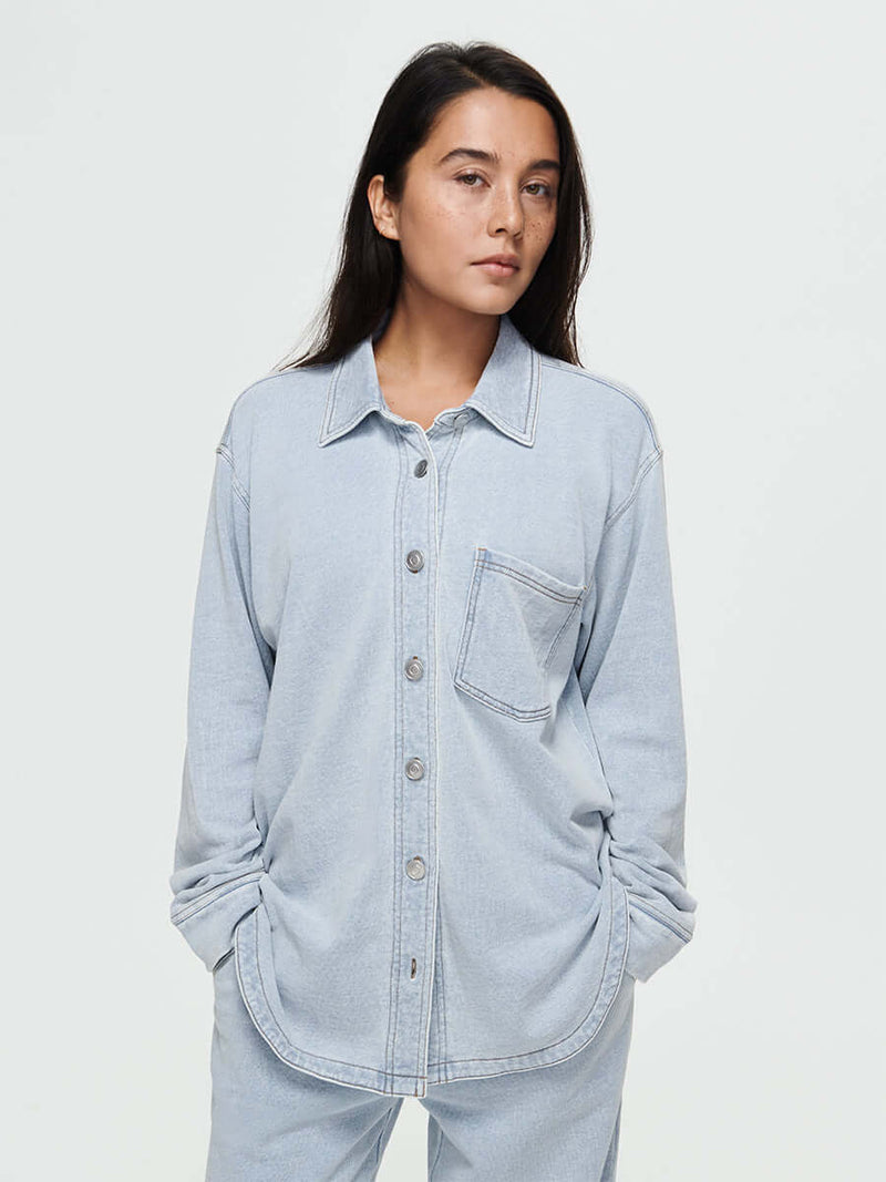 Desert Shirt in soft cotton terry with oversized fit, curved hem, and brushed silver buttons.