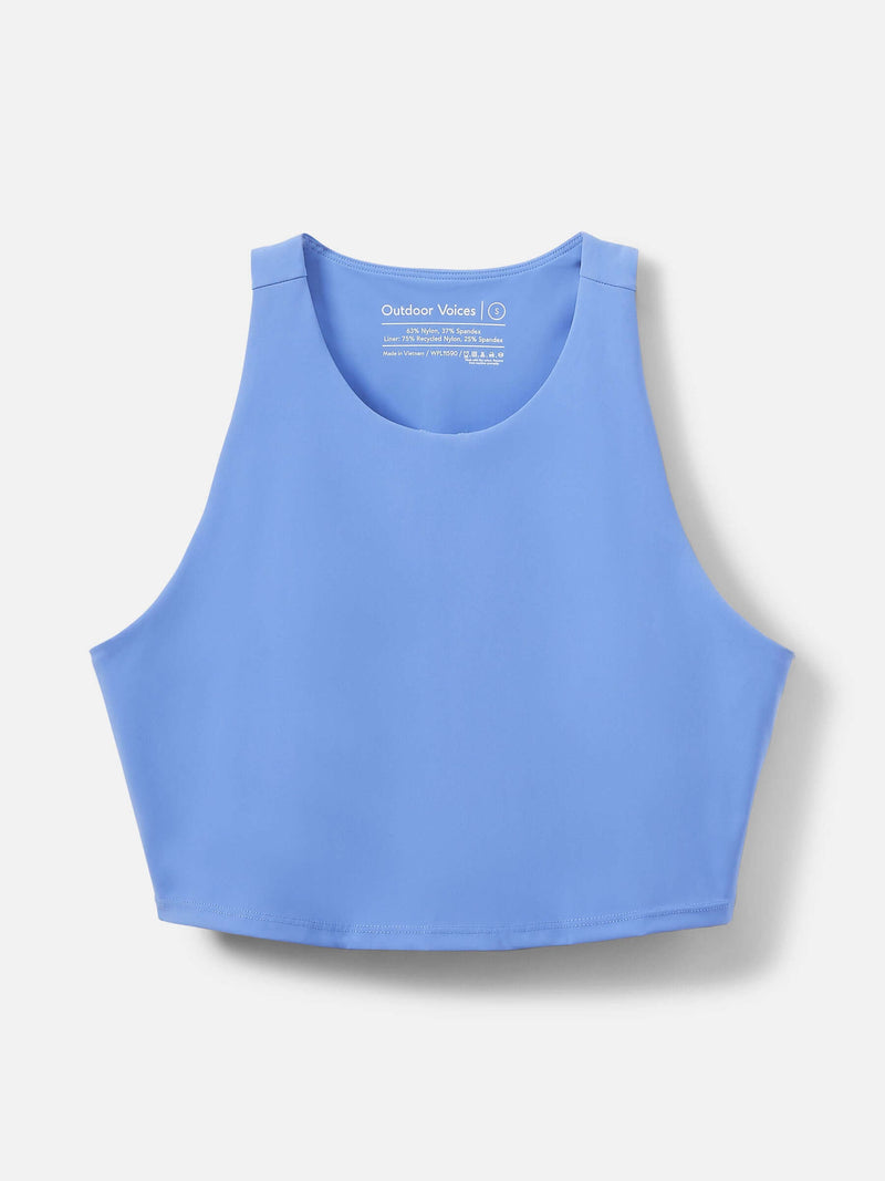 SuperForm Crop Top in light blue, featuring a high-coverage neckline and built-in shelf bra for light support.