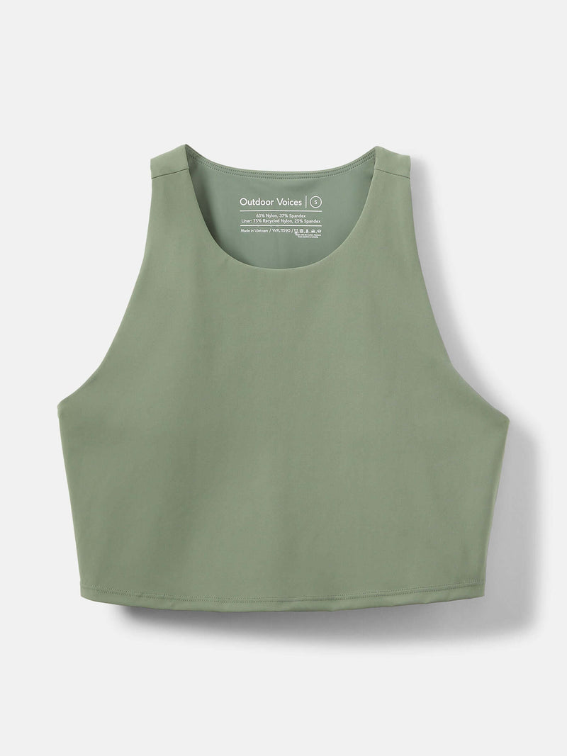 SuperForm Crop Top in light green, featuring a high-coverage neckline and built-in shelf bra for light support.