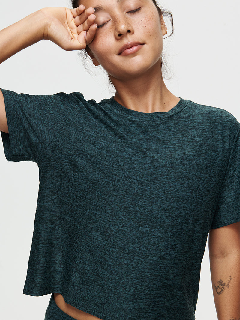 Model wearing the CloudKnit Boxy Shortsleeve shirt, showcasing comfort and style in breathable fabric.