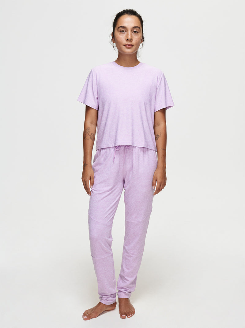Model wearing CloudKnit Sweatpant with matching top in lavender, showcasing comfort and style.