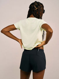 Model wearing ThinkFast Mesh Shortsleeve CL, showcasing the back design and fit of the stylish shorts.
