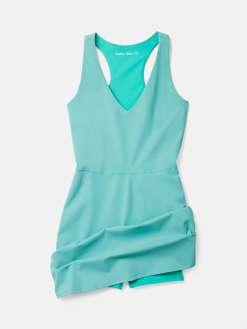 a person wearing a turquoise dress