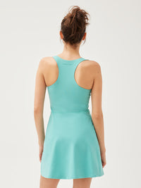 a person wearing a turquoise dress