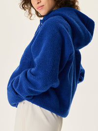 a person wearing a blue sweater