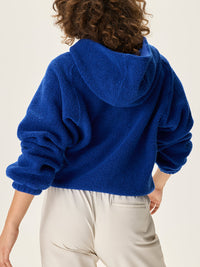 a person wearing a blue sweater