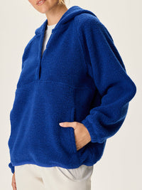 a person wearing a blue sweater