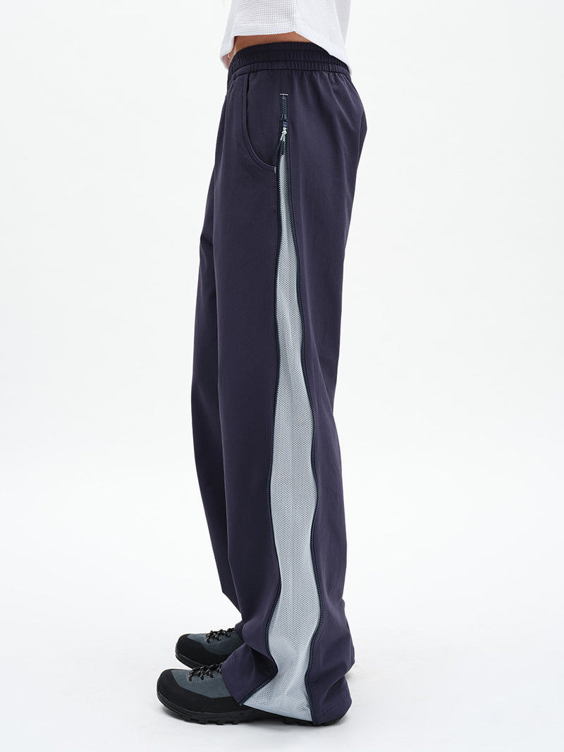RecTrek Zip Pant in Indigo Multi – side view showing contrast side panel