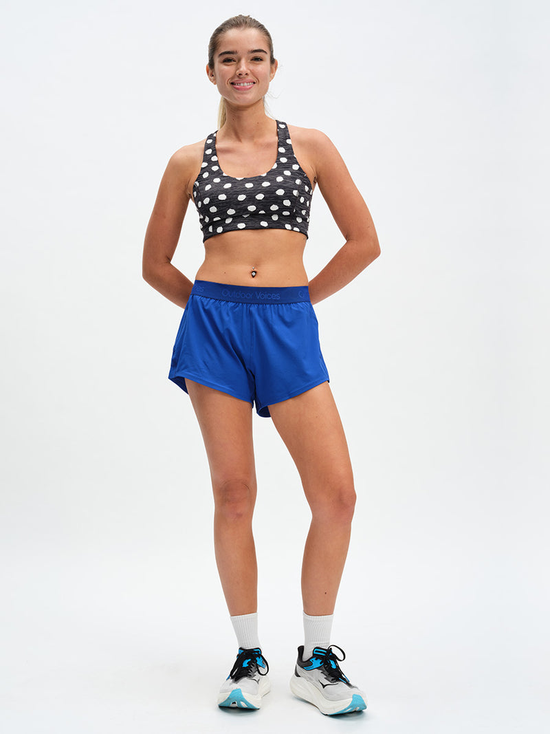 Relay 3" Short in OV Blue – front full-length view styled with polka dot bra