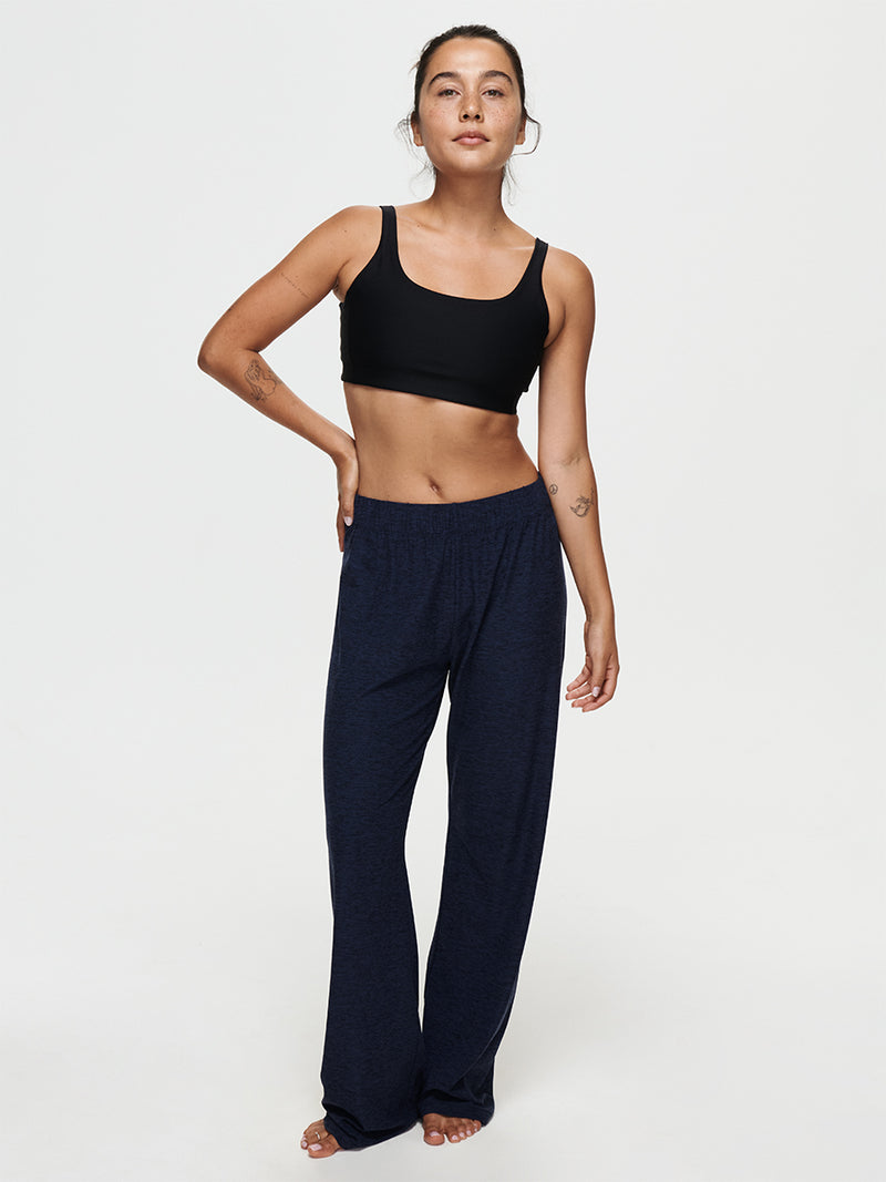 Model wearing CloudKnit Wide Leg Pant with a black crop top, showcasing comfort and style.