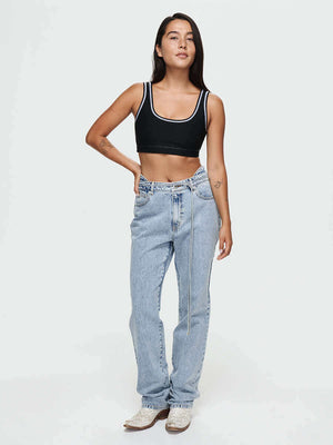 Model wearing Cowgirl Jean with a removable lasso belt, showcasing a stylish mid-rise bootcut design.