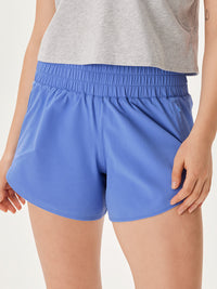 a person wearing blue shorts