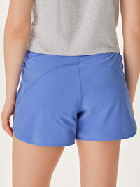 a person wearing blue shorts