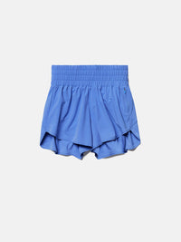 a person wearing blue shorts